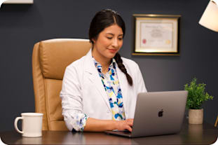 Doctor reviewing vision exam results on a computer